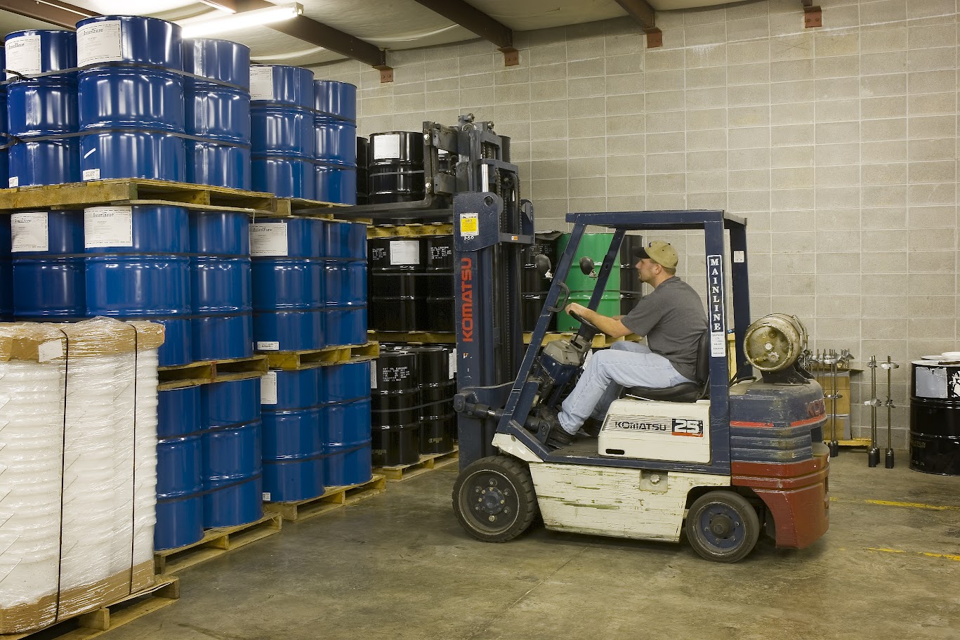 Industrial warehouse floor showing polymer coating application area - polyurea coating cost vs epoxy comparison